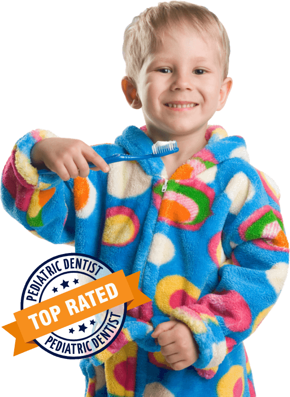 Kid wearing pajamas smiles with a toothbrush in his hand