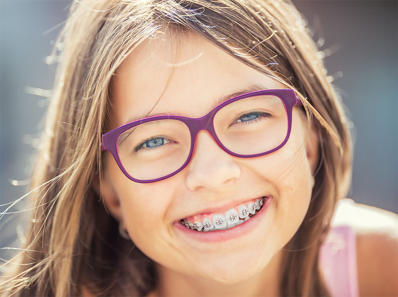 little girl with braces smiling
