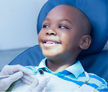 Kid smiling after getting dental treatment