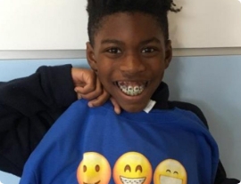 Child smiling and showing their awesome teeth