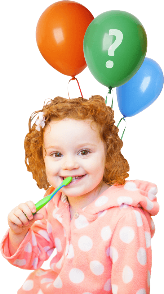 Little girl brushing her teeth and smiling while holding a bundle of balloons, the middle balloon is green with a question mark on it.
